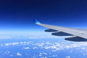 Airplane wing above clouds